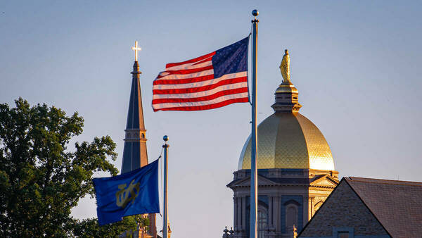 Golden Dome with American flag and Notre Dame flag