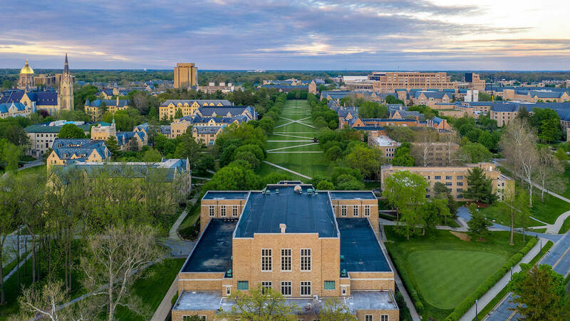 Southquad from above and facing east, with the setting sun highlighting the brick buildings on campus