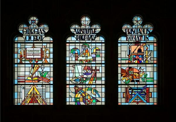 Interior view of three stained-glass windows in O'Shag.