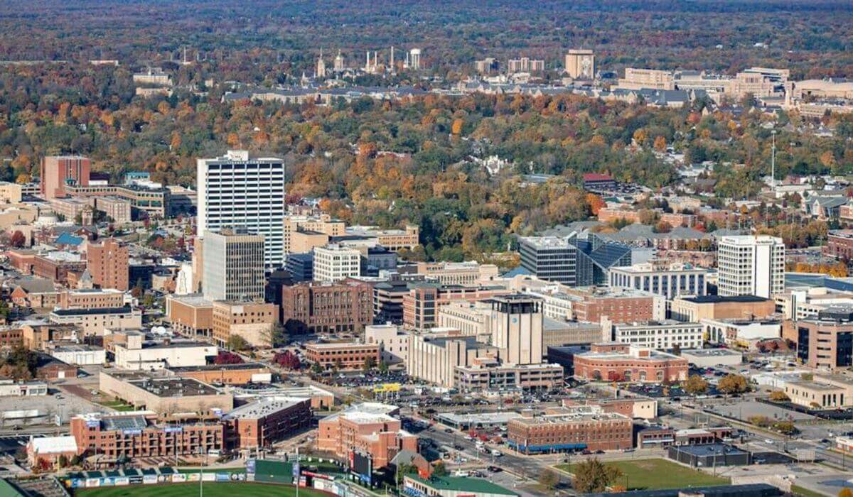 Aerial view of downtown South Bend with Notre Dame in the distance