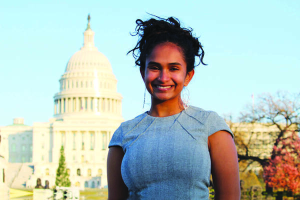 Notre Dame student intern standing in front of the U.S. Capitol building